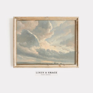 May include: A framed painting of a cloudy sky with a light blue, gray, and white color scheme. The sky is depicted in a realistic style with soft, fluffy clouds.