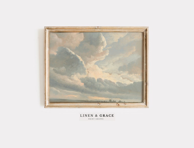 May include: A framed painting of a cloudy sky with a light blue, gray, and white color scheme. The sky is depicted in a realistic style with soft, fluffy clouds.