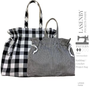 May include: Two black and white gingham tote bags with drawstring closures. The larger bag has handles and the smaller bag has a shorter handle. The bags are labeled "Lasenby Pockets Inside" and "Knitting/Crochet Project Bag".