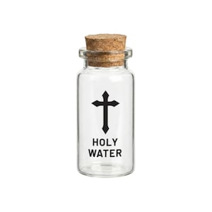 May include: A clear glass bottle with a cork stopper. The bottle has a black cross graphic and the words "HOLY WATER" printed on the front. The bottle is empty and ready to be filled.