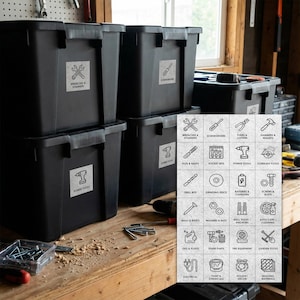 May include: Black storage bins labeled for tools, including wrenches, screwdrivers, and power tools. A variety of tools are visible on a wooden workbench, with labels for different tool categories.
