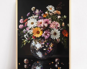 May include: A bouquet of colorful flowers, including pink, white, yellow, and orange daisies, are arranged in a silver disco ball vase. The vase is surrounded by small, reflective disco balls on a black surface.