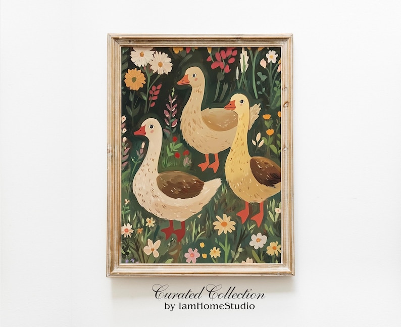 May include: A framed illustration of three geese in a field of flowers. The geese are white with yellow beaks and feet. The flowers are a variety of colours, including red, yellow, and blue. The background is a dark green.