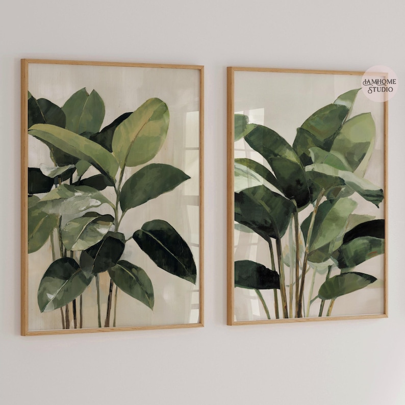 Puede incluir: Dos l&aacute;minas bot&aacute;nicas enmarcadas con exuberantes hojas verdes sobre un fondo neutro. La obra de arte est&aacute; encerrada en marcos de madera marr&oacute;n claro, creando una est&eacute;tica natural y elegante. Ideales para a&ntilde;adir un toque de naturaleza a cualquier espacio interior.