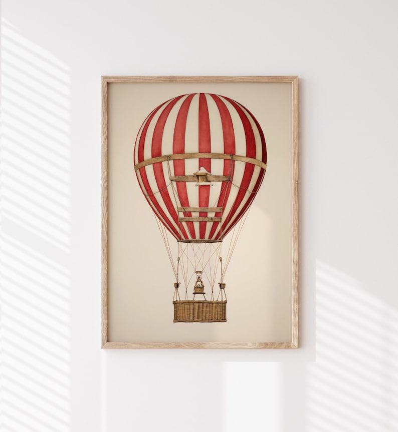 May include: A red and white striped hot air balloon with a wicker basket and a small bird flying above it.