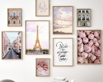 May include: A gallery wall with nine framed prints. The prints feature images of the Eiffel Tower, Parisian streets, hot air balloons, flowers, and a line drawing of a woman's face. The text "Paris is always a good idea" is written in black cursive on a white background.