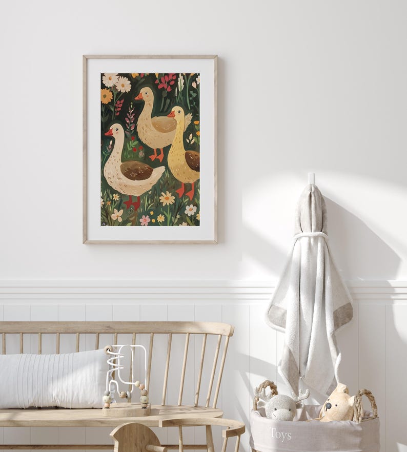 May include: A framed illustration of three white geese walking through a field of green grass and colourful flowers.
