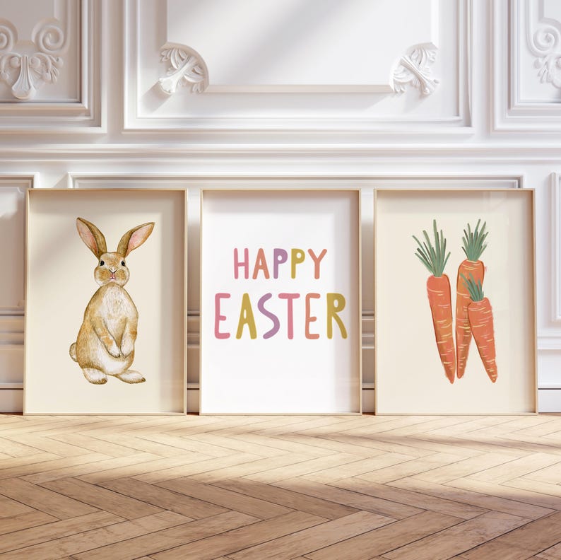 May include: Three framed prints with an Easter theme. The left print features a brown rabbit, the middle print says "Happy Easter" in colorful letters, and the right print shows three orange carrots.