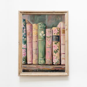 May include: An oil painting of a collection of books in a wooden frame. The books are in a row, with varying colors including pink, green, and yellow. Some books have floral designs. The painting is set against a neutral background.