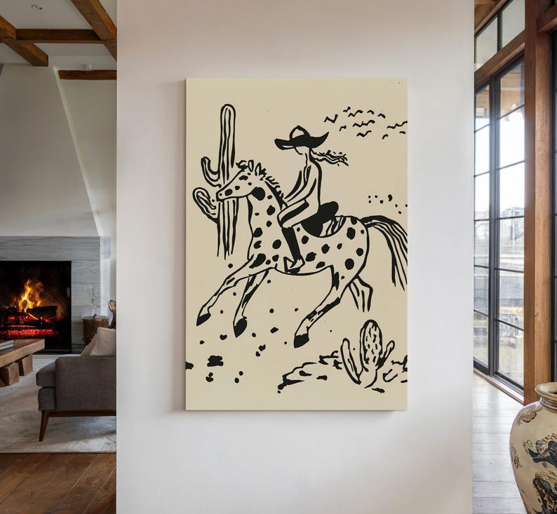 May include: Black and white illustration of a person riding a horse in a desert landscape. The person is wearing a cowboy hat and the horse has spots. There are cacti in the background.