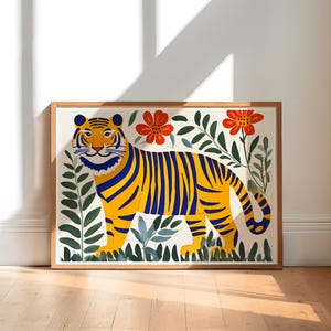 May include: A framed illustration of a yellow and blue striped tiger standing in a field of green leaves and red flowers.