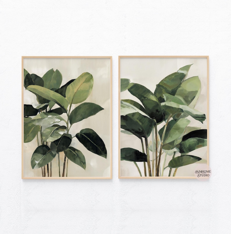 Puede incluir: Dos impresiones bot&aacute;nicas enmarcadas con exuberantes hojas verdes de plantas. La obra de arte tiene un fondo neutro y un marco de madera clara. Las hojas est&aacute;n pintadas en tonos verdes, creando una est&eacute;tica natural y relajante. Adecuado para la decoraci&oacute;n del hogar.