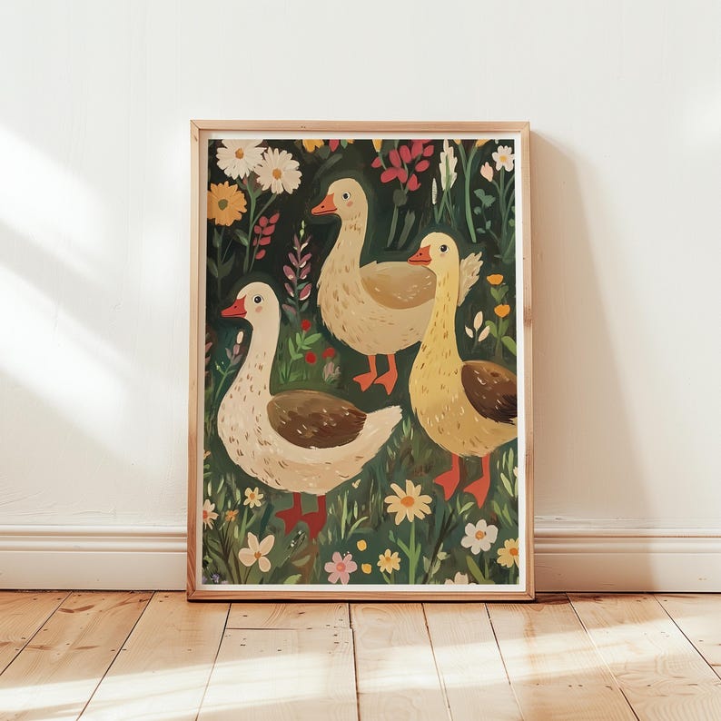 May include: A framed illustration of three geese in a field of flowers. The geese are white with brown markings and are standing in a field of green grass and colourful flowers. The background is a dark green.