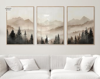 May include: A set of three rectangular wall art prints featuring a misty mountain landscape with dark evergreen trees in the foreground and light beige, hazy mountains in the background. The text JAMHOME STUDIO is visible in the top left corner.
