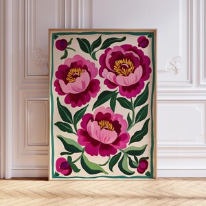 May include: A digital illustration of three pink and burgundy peonies with green leaves on a cream background. The flowers are framed in a green border.