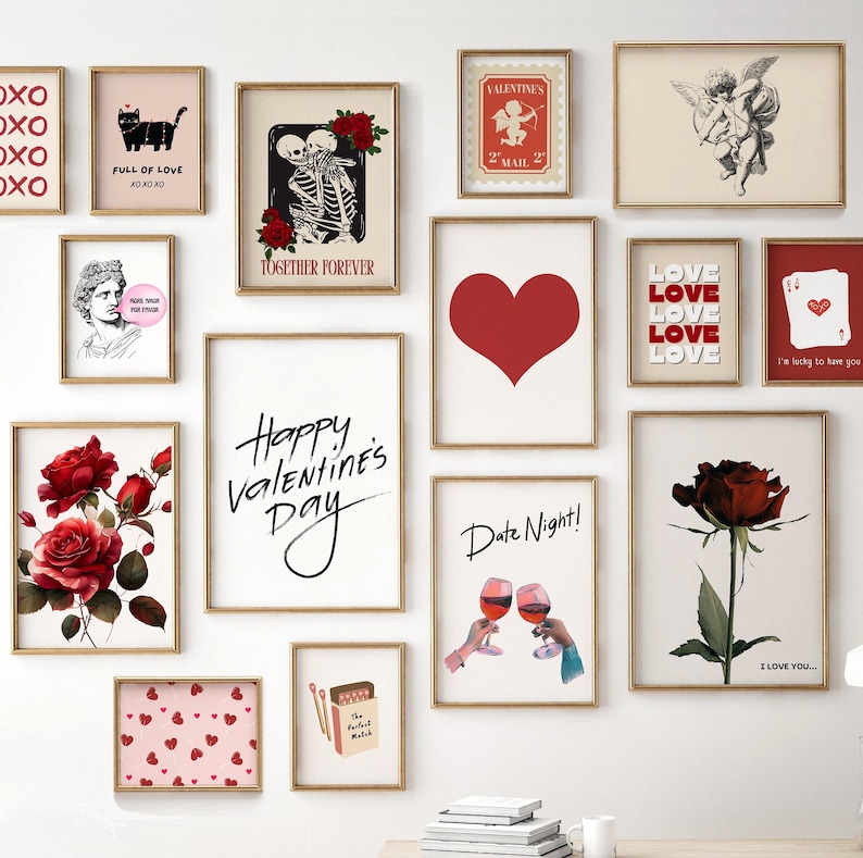 May include: A gallery wall of 12 framed prints with Valentine's Day themes. The prints feature hearts, roses, skeletons, cupids, and text that says "Happy Valentine's Day", "Date Night", "Love", "I'm lucky to have you", and "I love you".