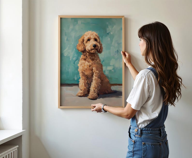 May include: A framed painting of a brown and white dog sitting on a blue background. The dog is looking up at the viewer.