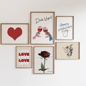 May include: A collection of eight framed prints with Valentine's Day themes. The prints feature a red heart, a couple toasting with wine glasses, a rose, a cupid, and the text "Love" and "Happy Valentine's Day".
