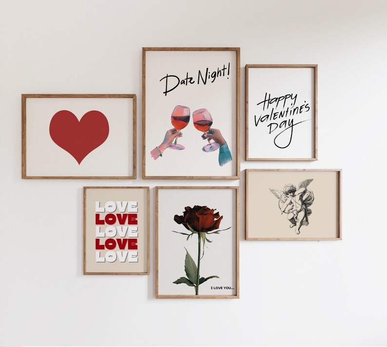 May include: A collection of eight framed prints with Valentine's Day themes. The prints feature a red heart, a couple toasting with wine glasses, a rose, a cupid, and the text "Love" and "Happy Valentine's Day".