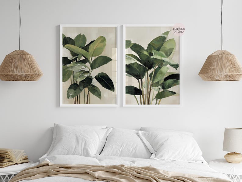 Puede incluir: Dos impresiones bot&aacute;nicas enmarcadas con ilustraciones en acuarela de exuberantes plantas verdes con hojas grandes. La obra de arte est&aacute; sobre un fondo neutro y enmarcada en blanco, creando una est&eacute;tica serena y natural.