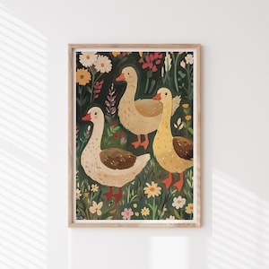 May include: A framed illustration of three geese standing in a field of flowers. The geese are white with brown markings and have orange beaks and feet. The flowers are a variety of colours, including red, yellow, and blue.