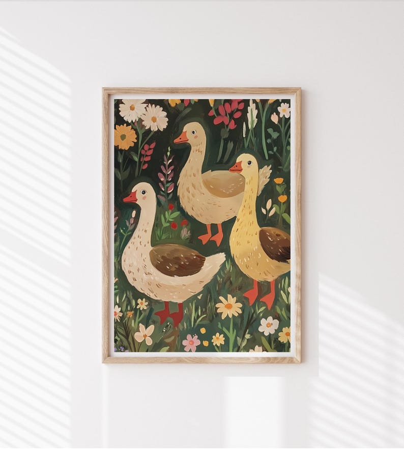 May include: A framed illustration of three geese standing in a field of flowers. The geese are white with brown markings and have orange beaks and feet. The flowers are a variety of colours, including red, yellow, and blue.