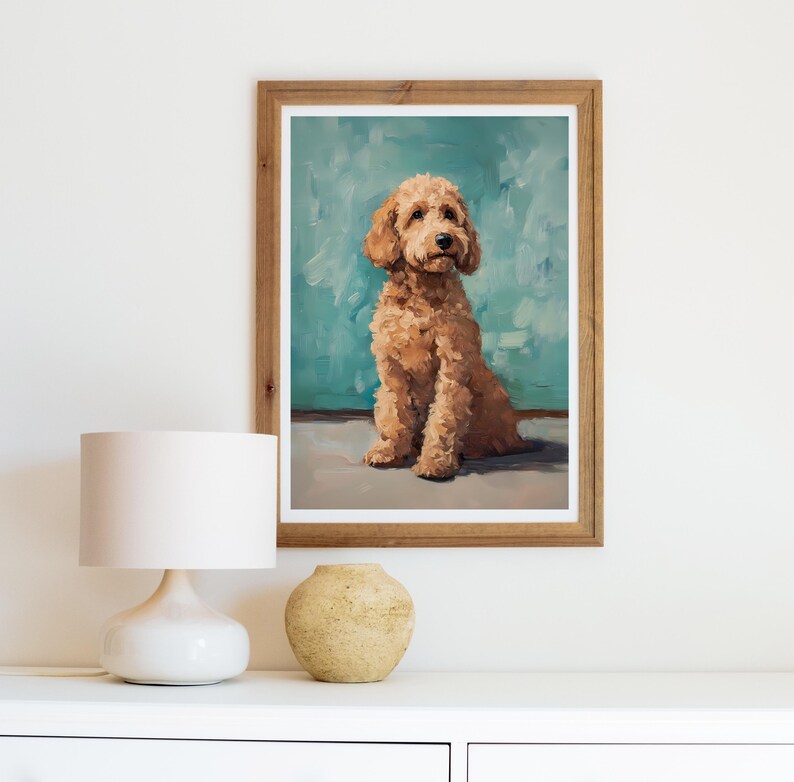 May include: A framed painting of a light brown dog sitting on a blue background. The dog is looking up and has a fluffy coat.