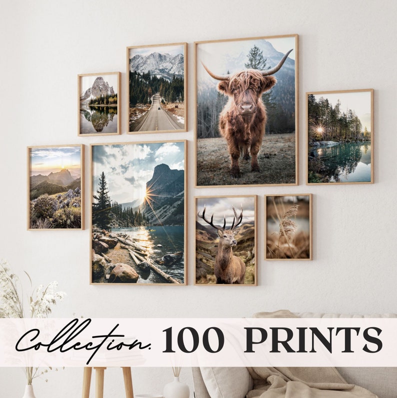 May include: A gallery wall of framed nature photographs. The photos feature a variety of landscapes, including mountains, forests, and lakes. There is also a photo of a Highland cow and a deer.