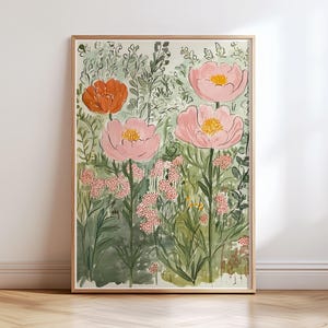 K&ouml;nnte beinhalten: Gerahmtes Aquarellgem&auml;lde mit einer Gartenszene. Das Kunstwerk zeigt gro&szlig;e rosa und orangefarbene Blumen mit gelben Zentren, umgeben von gr&uuml;nem Laub und kleineren rosa Bl&uuml;ten. Das Gem&auml;lde befindet sich in einem hellen Holzrahmen.