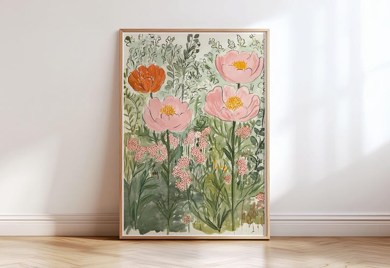 K&ouml;nnte beinhalten: Gerahmtes Aquarellgem&auml;lde mit einer Gartenszene. Das Kunstwerk zeigt gro&szlig;e rosa und orangefarbene Blumen mit gelben Zentren, umgeben von gr&uuml;nem Laub und kleineren rosa Bl&uuml;ten. Das Gem&auml;lde befindet sich in einem hellen Holzrahmen.