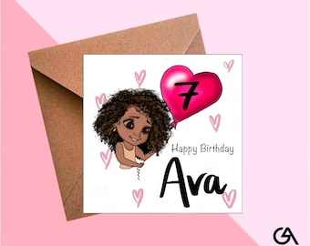 May include: A birthday card featuring a cartoon girl with curly hair holding a pink balloon with the number 7. The card says "Happy Birthday Ava" with pink hearts. The card is inside a brown envelope.