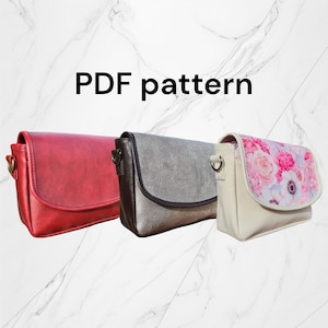 Może przedstawiać: Trzy różne style toreb na ramię. Pierwsza torba jest czerwona, druga jest szara, a trzecia jest kremowa z kwiatowym nadrukiem. Wzór PDF.