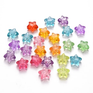 Transparenta stjärnpärlor i akryl, cirka 10,5 mm x 11 mm x 6 mm, röd, blå, gul, orange, rosa, grön, lila, borrade
