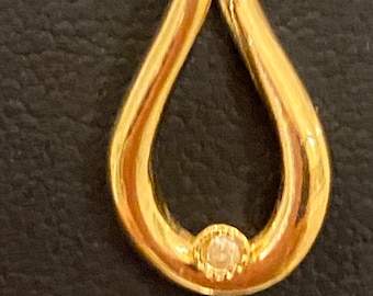 Elegant Estate Aldo Cipullo Gold Colored Pendant with Small Rhinestone or Faux Diamond, approx. 15mm long and 10mm wide, just over 1g