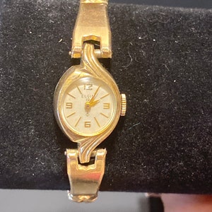 Vintage Ladies Elgin 10K Gold (RGP) Bezel, 19 Jewels, Stainless Steel Back Wrist Watch, Stretch Band, Works Great