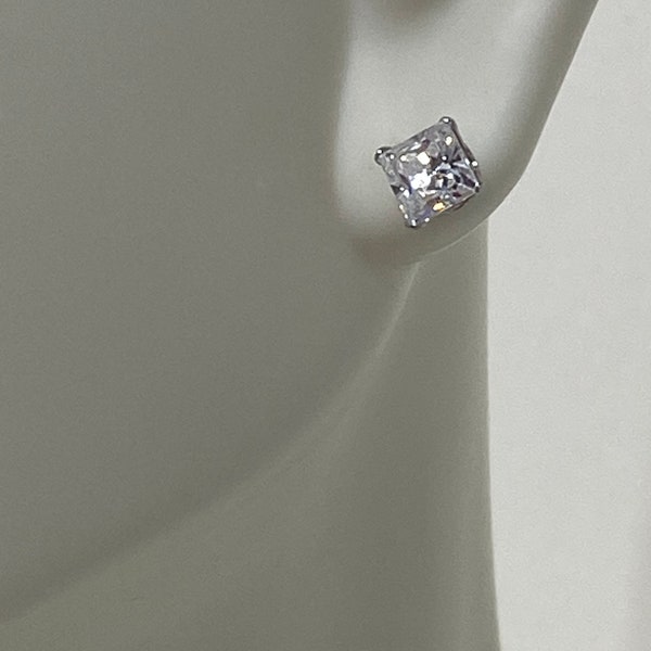 Lovely Diamond Stud Earrings, Set in 14K gold, Signed JCM CZ (cubic zirconia)?, they are Marked 14K though and have beet tested.  The posts