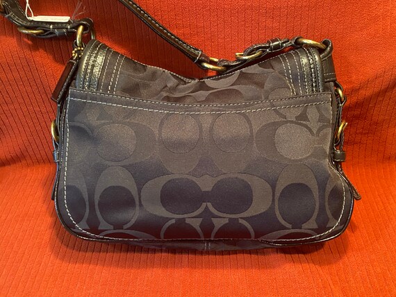 black signature coach purse