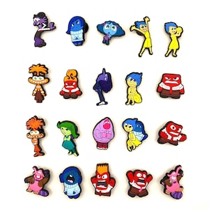 May include: Set of 18 colourful cartoon character shoe charms featuring characters from the movie Inside Out. The characters include Joy, Sadness, Anger, Fear, Disgust, Bing Bong, and others.