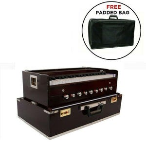May include: A dark brown wooden harmonium featuring a keyboard with white and black keys, a row of silver knobs, and a rectangular base with a metal handle and latch. A separate black padded bag is shown in a circular inset with the text FREE PADDED BAG.