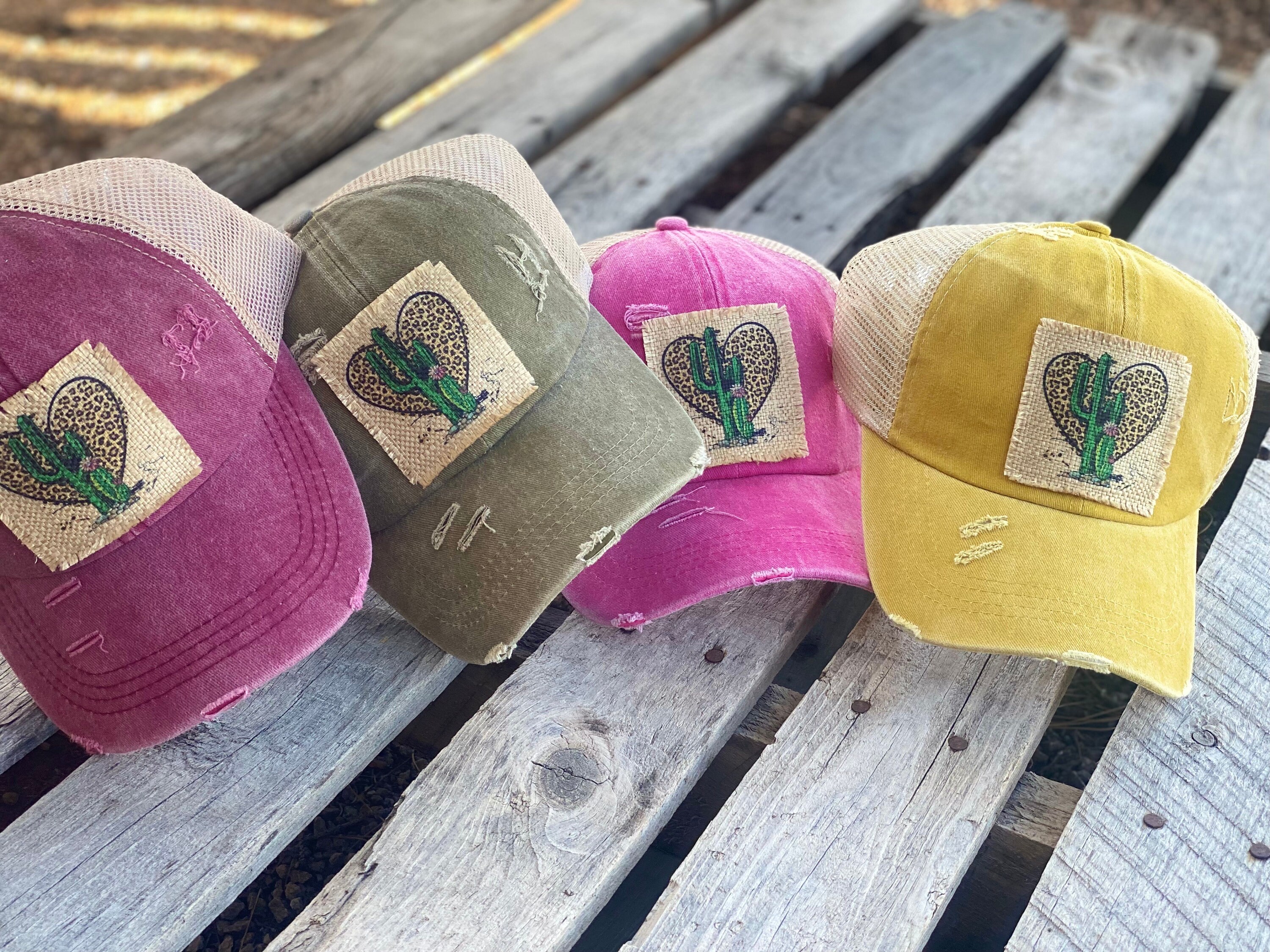 Cheetah cactus heart distressed trucker hat. Cross cross back