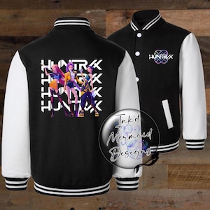 May include: Black varsity jacket with white sleeves and striped cuffs. The jacket features a colorful graphic of three figures and the word "HUNTRX" in white. The jacket has a button-up front and a logo on the chest.