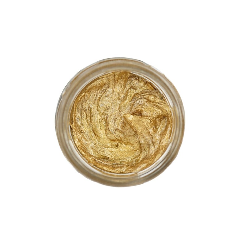 May include: A small glass jar filled with a swirl of gold metallic paint.