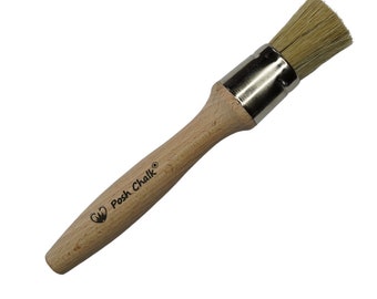 May include: A wooden-handled paint brush with a natural bristle head. The brush is labeled "Posh Chalk®" and is designed for painting and crafting.