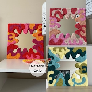 May include: Three square mirrors with thick, textured, tufted yarn frames featuring organic, wavy, abstract shapes. One frame uses red, orange, and pink tones, another uses pink and peach, and the third uses shades of blue, green, and yellow.