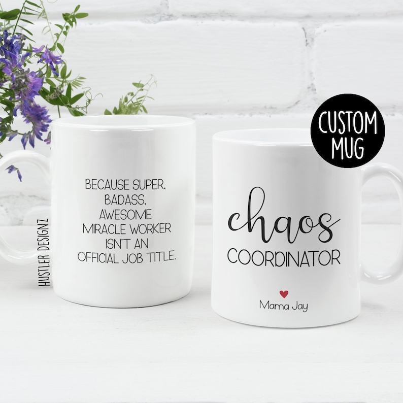 May include: Two white ceramic mugs with black text. The mug on the left says "Because super, badass, awesome miracle worker isn't an official job title." The mug on the right says "chaos coordinator" with a small red heart and the text "Mama Jay" below. The text "CUSTOM MUG" is in a black circle in the upper right corner of the image.