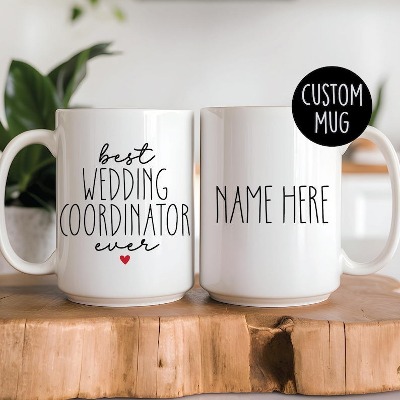 Custom ceramic mug with the text Best Wedding Coordinator Ever. available in 11 oz and 15 oz sizes, customizable with a name on the back, featuring colored handle options.