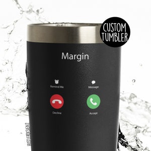 May include: Black stainless steel tumbler with a phone screen design. The screen displays a call from "Margin" with options to "Remind Me", "Message", "Decline", and "Accept".