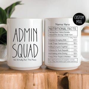 May include: White ceramic mug with the words "ADMIN SQUAD" in black, with "We Actually Run This Place" below. The other side features a "Nutritional Facts" label with humorous stats. A black circle reads "CUSTOM MUG".
