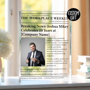 May include: A clear acrylic plaque with a newspaper design, headlined "Breaking News: Joshua Mikey Celebrates 10 Years at [Company Name]." Includes a photo of a man in a suit and the text "Custom Gift."