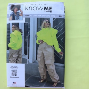 May include: A sewing pattern package featuring a woman in a neon green hoodie and tan cargo pants. The package has the text "KNOW ME" and "KEECHI B STYLE" printed on it. The package also has the text "SIZE W3 (30W-32W-34W-36W-38W)".